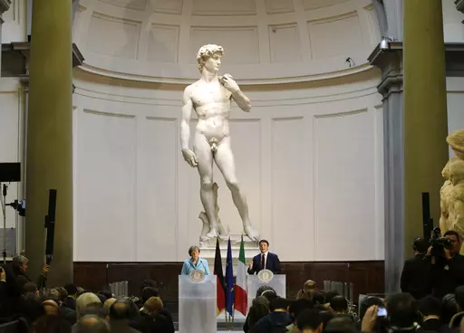 German Chancellor Angela Merkel, left, and Italian Prime Minister Matteo Renzi speak during a press conference in front of Michelangelo's "David statue" after their bilateral summit in Florence, Italy, on Jan. 23, 2015. The head of Florence’s Galleria del’Accademia on Sunday March 26, 2023 invited the parents and students of a Florida charter school to visit and see Michelangelo’s “David,” after the school principal was forced to resign following parental complaints that an image of th