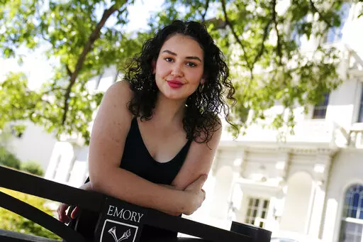 Helen Khuri poses for a portrait on the campus of Emory University Thursday, Oct. 6, 2022, in Atlanta. Khuri’s mother found a specialist to help her when the 19-year-old’s post-traumatic stress disorder flared up last spring. But the Emory University student had to temporarily move from Atlanta to Boston for treatment, even though she never set foot inside the hospital offering it. “It didn’t necessarily make sense to … kind of uproot my life, just to receive this three-week treatment 