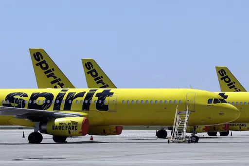 A line of Spirit Airlines jets sit on the tarmac at Orlando International Airport on May 20, 2020, in Orlando, Fla. A 6-year-old boy who left on a flight for the Christmas holiday to visit his grandmother was put on the wrong plane. When the grandmother, up on Thursday, Dec. 21, 2023 at the airport in Fort Myers to greet her grandson who was flying for the first time from Philadelphia, she was told he wasn’t on the Spirit Airlines flight. (AP Photo/Chris O'Meara, File)