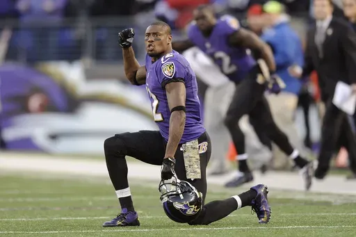 In this Nov. 10, 2013 file photo, Baltimore Ravens wide receiver Jacoby Jones cheers in overtime of an NFL football game against the Cincinnati Bengals in Baltimore. The Houston Texans, Jones' team for the first five seasons of his career, announced his death Sunday, July 14, 2024. He was 40. (AP Photo/Nick Wass, File)