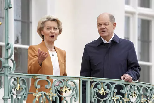 German Chancellor Olaf Scholz, right, welcomes European Commission President Ursula von der Leyen, left, for a meeting as part of a two-day closed meeting of the German government at Meseberg palace in Gransee near Berlin, Germany, Sunday, March 5, 2023. (AP Photo/Michael Sohn)