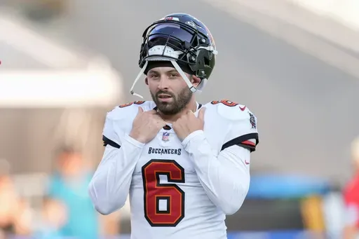 Tampa Bay Buccaneers quarterback Baker Mayfield gets ready for warm ups before an NFL preseason football game against the Jacksonville Jaguars, Saturday, Aug. 17, 2024, in Jacksonville, Fla. (AP Photo/John Bazemore)