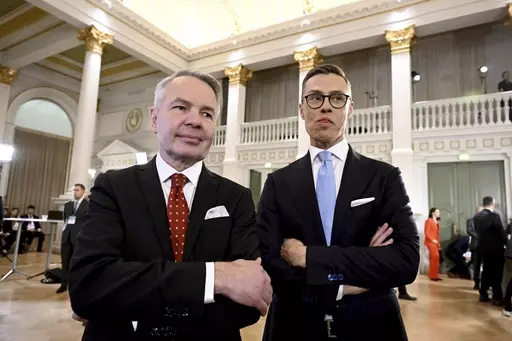 Leaders after the early vote results, National Coalition Party candidate Alexander Stubb, right, and Social Movement candidate Pekka Haavisto stand during the Presidential election event, at the Helsinki City Hall, in Helsinki, Finland, Sunday, Jan. 28, 2024. Finns on Sunday, Feb. 11, 2024 will pick a new head of state from the array of two experienced politicians whose main will be to steer the Nordic country’s foreign and security policy at an unprecedented time when the country is now a NAT