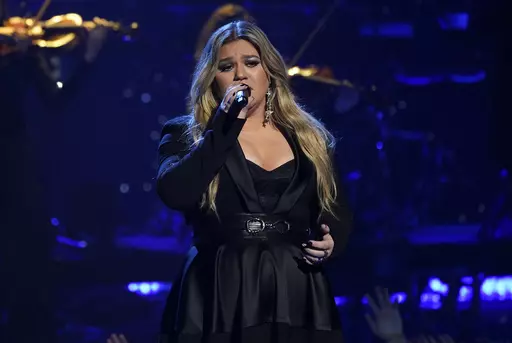 Kelly Clarkson performs during a tribute to Icon award winner Pink at the iHeartRadio Music Awards on Monday, March 27, 2023, at the Dolby Theatre in Los Angeles. Clarkson has responded, Saturday, May 13, to a Rolling Stone report accusing her daytime talk show of being a toxic workplace. She addressed the allegations after 11 current and former employees complained about being overworked and underpaid on “The Kelly Clarkson Show” in which they also called “traumatizing to their mental hea