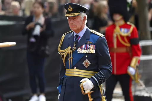 Britain's King Charles III walks behind the coffin during the procession for Queen Elizabeth II, in London, Wednesday, Sept. 14, 2022. The Queen will lie in state in Westminster Hall for four full days before her funeral on Monday Sept. 19. (Kate Green/Pool Photo via AP)