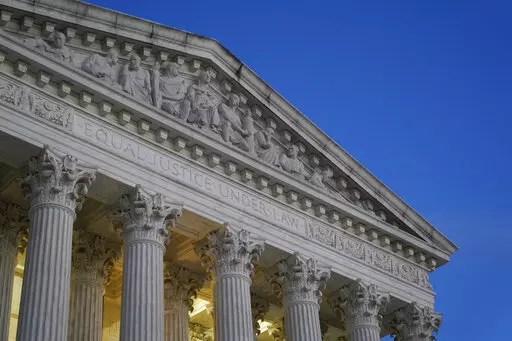 Light illuminates part of the Supreme Court building at dusk on Capitol Hill in Washington, Nov. 16, 2022. The Supreme Court said Thursday, Jan. 19, 2023, that it has not determined who leaked a draft of the court's opinion overturning abortion rights, but that the investigation continues. (AP Photo/Patrick Semansky, File)