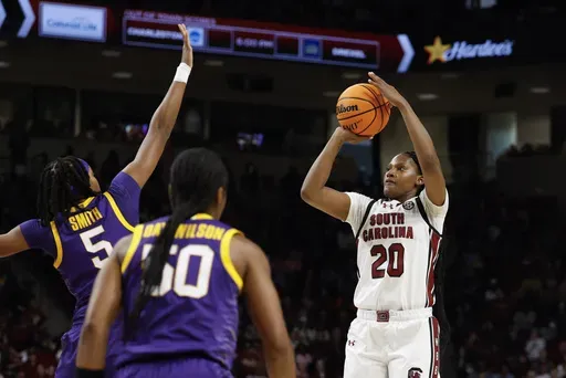 South Carolina forward Sania Feagin (20) looks to shoot over LSU forward Sa'Myah Smith (5) during the first half of an NCAA college basketball game in Columbia, S.C., Friday, Jan. 24, 2025. (AP Photo/Nell Redmond)