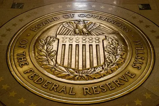 The seal of the Board of Governors of the United States Federal Reserve System is displayed in the ground at the Marriner S. Eccles Federal Reserve Board Building in Washington, Feb. 5, 2018. (AP Photo/Andrew Harnik, File)