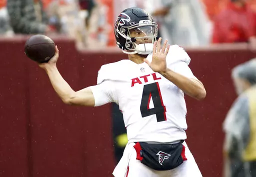 Atlanta Falcons quarterback Desmond Ridder (4) throws before an NFL football game against the Washington Commanders on Nov. 27, 2022, in Landover, Md. The Atlanta Falcons will have more on the line than retaining hope in the weak NFC South race as rookie quarterback Ridder makes his debut as the starter on Sunday, Dec. 18, at New Orleans. (AP Photo/Daniel Kucin Jr., File)