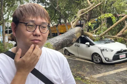 Song Zi-jie, 28 years old ride-hailing service driver, talks about his experience a day after a tree collapsed on his car while he was inside as Typhoon Kong-rey sweeps through Taipei, Taiwan on Friday, Nov. 1, 2024. (AP Photo/Johnson Lai)