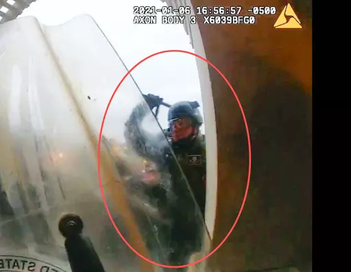This image from police body-worn camera video, contained and annotated in the Justice Department's statement of facts, supporting the arrest warrant for Edward Richmond Jr., at the U.S. Capitol on Jan. 6, 2021, in Washington. Richmond, a former U.S. Army soldier who was convicted of manslaughter for fatally shooting a handcuffed cowherd in Iraq, was ordered jailed Jan. 30, 2024, on charges that he used a metal baton to assault police officers during a mob's attack on the U.S. Capitol on Jan. 6, 