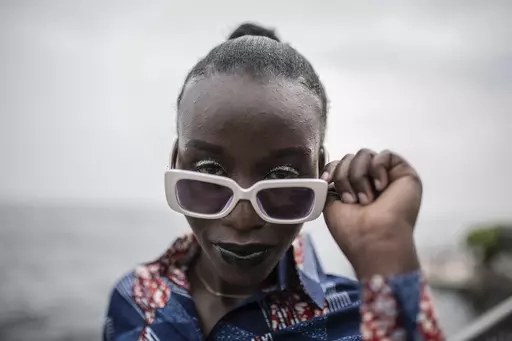A model presenting dresses by Central African Republic fashion designer Ketura Kimono Milca looks on during the ninth edition of the Liputa fashion show in Goma, Democratic Republic of Congo, Saturday June 24, 2023. The objective of the show, involving designers, models and artists from DRC, Cameroon, Central African Republic, Senegal, Burundi, France, United States and others, is to reveal the latest trends, but also to deliver a message of peace and peaceful coexistence during a period of high