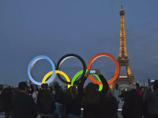 The Olympic rings are set up on Trocadero plaza that overlooks the Eiffel Tower, a day after the official announcement that the 2024 Summer Olympic Games will be in the French capital, in Paris, Thursday, Sept. 14, 2017. The organizers of the Paris Games say the Olympic rings will be displayed on the Eiffel Tower. The five-ring creation is 29-meters long and 15-meter high, made entirely of recycled steel, the Games organizers said in a statement Monday April, 8, 2024. (AP Photo//Michel Euler, Fi