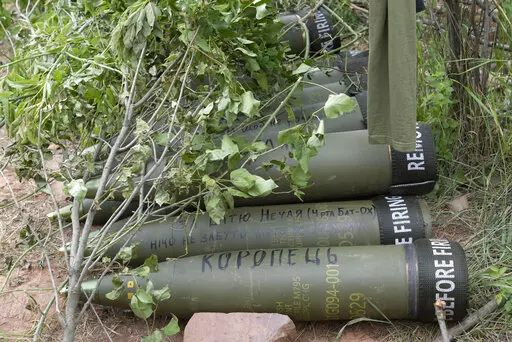 U.S.-supplied M777 howitzer shells lie on the ground to fire at Russian positions in Ukraine's eastern Donbas region June 18, 2022. The intense firefight over Ukraine has the Pentagon rethinking its weapons stockpiles. If another major war broke out today, would the U.S. have enough ammunition to fight? It’s a question Pentagon planners are grappling with not only as the look to supply Ukraine for a war that could stretch for years, but also as they look to a potential conflict with China. (AP