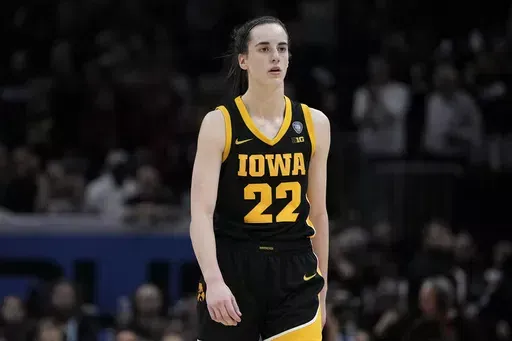 Iowa guard Caitlin Clark walks to the bench during the second half of the Final Four college basketball championship game against South Carolina in the women's NCAA Tournament, Sunday, April 7, 2024, in Cleveland. South Carolina won 87-75. (AP Photo/Morry Gash)