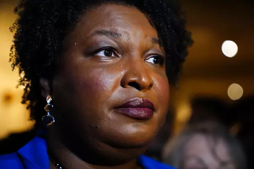 Georgia gubernatorial Democratic candidate Stacey Abrams talks to the media after qualifying for the 2022 election on Tuesday, March 8, 2022, in Atlanta. When she ended her first bid to become Georgia governor in 2018, Abrams announced plans to sue over the way the state’s elections were managed. More than three years later, as she makes another run at the governor’s mansion, the lawsuit filed in Nov. 2018 by Abrams' Fair Fight Action organization is finally going to trial on Monday, April 1