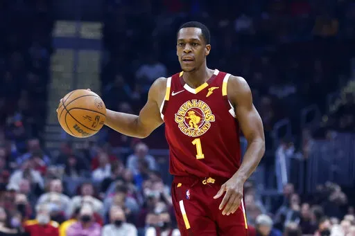 Cleveland Cavaliers' Rajon Rondo (1) plays against the San Antonio Spurs during the first half of an NBA basketball game, Wednesday, Feb. 9, 2022, in Cleveland. A Louisville woman has filed for an emergency protective order against Rondo and alleges the former Kentucky star brandished a gun and threatened her life. (AP Photo/Ron Schwane, File)