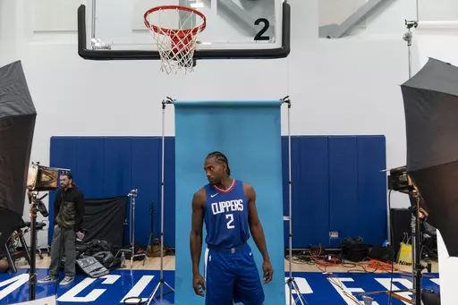 Los Angeles Clippers forward Kawhi Leonard poses for photos during the NBA basketball team's media day, Monday, Oct. 2, 2023, in Los Angeles. (AP Photo/Jae C. Hong)