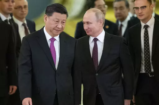 Chinese President Xi Jinping, left, and Russian President Vladimir Putin enter a hall for talks in the Kremlin in Moscow, Russia, June 5, 2019. The Chinese government said Xi would visit Moscow from March 20, to March 22, 2023, but gave no indication when he departed. The Russian government said Xi was due to arrive at midday and meet later with Putin.(AP Photo/Alexander Zemlianichenko, Pool, File)