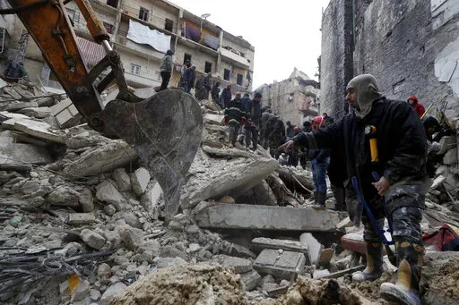 Syrian Civil Defense workers and security forces search through the wreckage of collapsed buildings after a devastating earthquake rocked Syria and Turkey, in Aleppo, Syria, Monday, Feb. 6, 2023. For years, the people of Aleppo bore the brunt of bombardment and fighting when their city, once Syria's largest and most cosmopolitan, was one of the civil war's fiercest battle zones. Even that didn't prepare them for the new devastation and terror wreaked by this week's earthquake. (AP Photo/Omar San