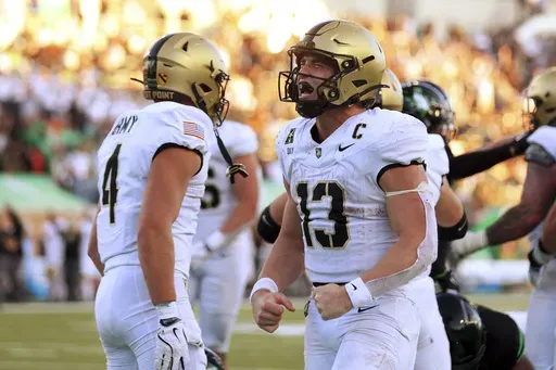 Army quarterback Bryson Daily (13) celebrates after a touchdown against North Texas in the second half of an NCAA football game Saturday, Nov. 9, 2024, in Denton, Texas. (AP Photo/Richard W. Rodriguez)