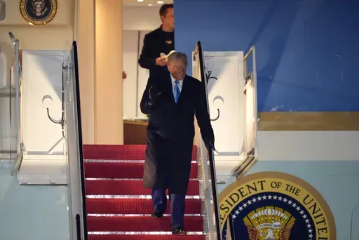 President Donald Trump, followed by Elon Musk, arrives on Air Force One, Wednesday, Feb. 19, 2025, at Joint Base Andrews, Md, after returning from Florida. (AP Photo/Mark Schiefelbein)