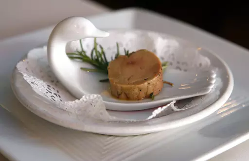 A serving of salt-cured fresh foie gras with herbs is displayed at Chef Didier Durand's Cyrano's Bistrot and Wine Bar in Chicago, Aug. 9, 2006. The Supreme Court is leaving in place a lower court ruling against duck liver lovers, declining Monday, May 22, 2023, to step in and hear a dispute over a California law that bars foie gras from being sold in the state. (AP Photo/M. Spencer Green, File)