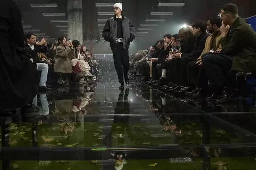 A model wears a creation part of the men's Prada Fall-Winter 2024-2025 collection, that was presented in Milan, Italy, Sunday, Jan. 14, 2024. (AP Photo/Luca Bruno).
