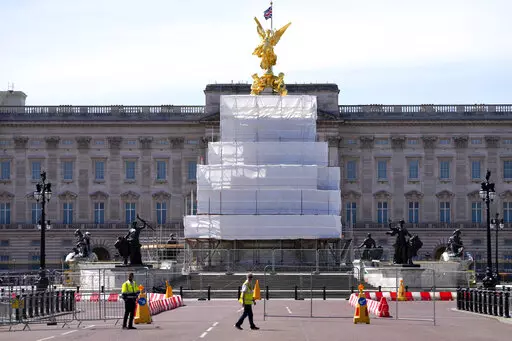 Building work in preparation for the Platinum Jubilee celebrations take place in front of Buckingham Palace in London, Friday, May 6, 2022. Britain's Queen Elizabeth II acceded to the throne on the death of her father King George VI on Feb. 6, 1952, and the Platinum Jubilee bank holiday weekend celebrations will take place on June 2-5. (AP Photo/Kirsty Wigglesworth)