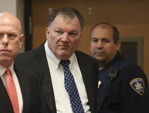 Rex Heuermann, center, charged in the Gilgo Beach serial killings on Long Island, appears for a hearing, Tuesday, July 30, 2024, at Suffolk County Court in Riverhead, N.Y. (James Carbone/Newsday via AP, File, Pool)