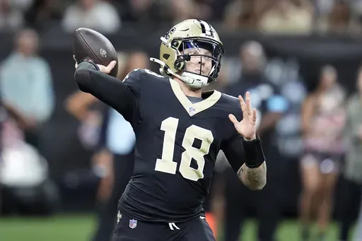 New Orleans Saints quarterback Spencer Rattler (18) passes against the Tampa Bay Buccaneers during the first half of an NFL football game in New Orleans, Sunday, Oct. 13, 2024. (AP Photo/Michael Conroy)