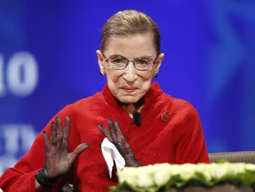 Supreme Court Associate Justice Bader Ginsburg is seen on stage at the Women's Conference Tuesday, Oct. 26, 2010, in Long Beach, Calif. A collection of nearly 100 items is being sold in an online auction that begins Wednesday, Sept. 7, 2022, and runs through Sept. 16, including a pair of black gloves owned by Ginsburg. It concludes just before the two-year anniversary of Ginsburg's death at 87. The proceeds will benefit SOS Children’s Villages, an organization that supports vulnerable children