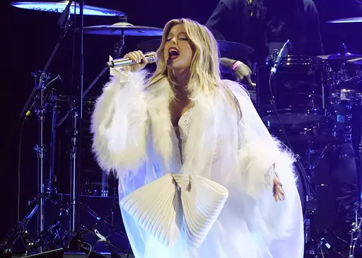 Bebe Rexha performs at the iHeartRadio Jingle Ball in Los Angeles. A man was arrested after throwing a cellphone that struck artist Rexha in the face on June 18. (AP Photo/Chris Pizzello, File)