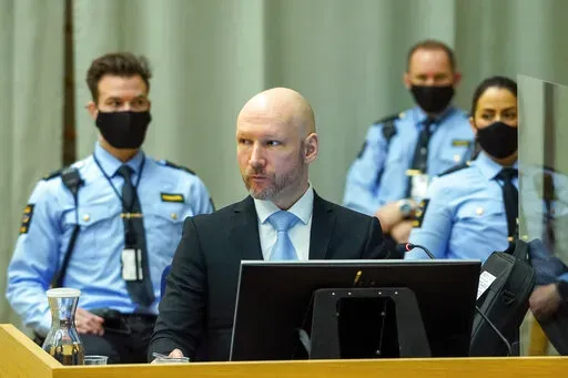 Convicted mass murderer Anders Behring Breivik sits in the makeshift courtroom in Skien prison on the second day of his hearing where he is requesting release on parole, in Skien, Norway, Jan. 19, 2022. A decade after the 2011 bombing and shooting spree that left 77 dead, Breivik is seeking early release from a 21-year sentence — the maximum term in Norway. (Ole Berg-Rusten/NTB scanpix via AP, File)