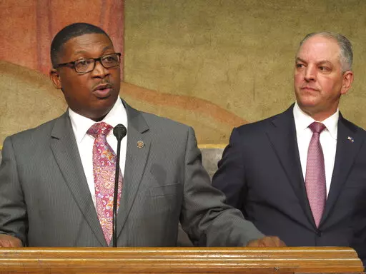 Transportation and Development Secretary Shawn Wilson, left, speaks about proposed surplus spending on roadwork as Louisiana Gov. John Bel Edwards listens, March 28, 2018, in Baton Rouge, La. Wilson, who is considered a possible Democratic gubernatorial candidate, informed Edwards on Wednesday, Feb. 15, 2023, that he is retiring from his state DOTD position. (AP Photo/Melinda Deslatte, File)