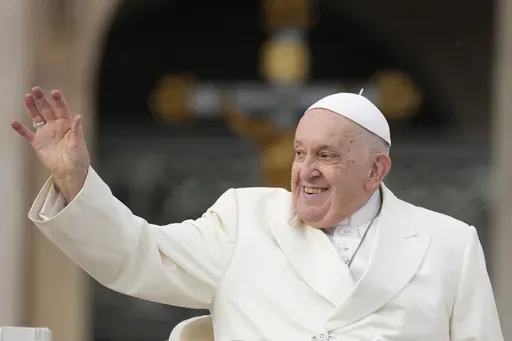 Pope Francis smiles as he waves faithful at the end of his weekly general audience in St. Peter's Square, at the Vatican, Wednesday, Nov. 22, 2023. (AP Photo/Andrew Medichini)