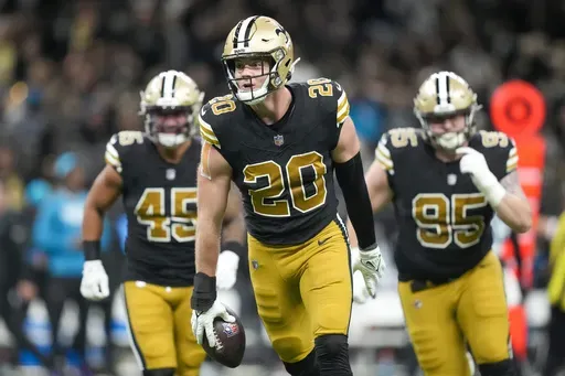New Orleans Saints linebacker Pete Werner celebrates after recovering a fumble by Carolina Panthers quarterback Bryce Young during the first half of an NFL football game in New Orleans, Sunday, Dec. 10, 2023. (AP Photo/Gerald Herbert, File)