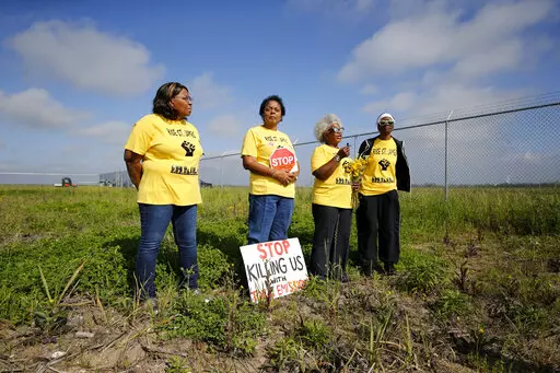 In this March 11, 2020, file photo, Sharon Lavigne, founder of environmental justice group Rise St. James, is second from the left as she and members Myrtle Felton, Gail LeBoeuf and Rita Cooper, speak against plans for a $9.4 billion chemical complex near Donaldsonville, La. Lavigne will receive what the University of Notre Dame describes as the oldest and most prestigious honor for American Catholics at the school’s commencement ceremonies May 15, 2022,  in South Bend, Indiana.. (AP Photo/Ger