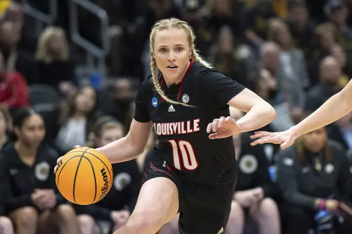 Louisville guard Hailey Van Lith dribbles the ball during an Elite 8 college basketball game of the NCAA Tournament against Iowa, Sunday, March 26, 2023, in Seattle. In discussing a revamped Louisville squad that will feature six transfers, Louisville coach Jeff Walz also addressed the surprising departure this spring of leading scorer Van Lith. (AP Photo/Stephen Brashear, File)