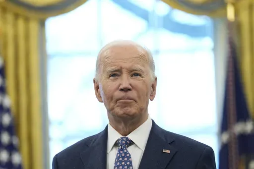 President Joe Biden pauses during a photo opportunity with Medal of Valor recipients in the Oval Office of the White House in Washington, Jan. 3, 2025. (AP Photo/Susan Walsh, File)