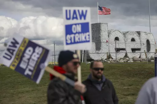 Striking UAW workers picket at the Jeep Assembly Plant on Oct. 9, 2023 in Toledo, Ohio. The UAW contends that the furloughs by Detroit's three automakers were not necessary and are being done in an effort to push members to accept less in contract negotiations. (Jonathan Aguilar/The Blade via AP, File)