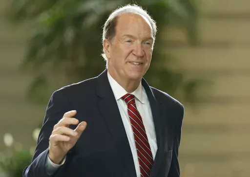 David Malpass, president of the World Bank Group, arrives for a meeting with Japan's Prime Minister Fumio Kishida at Kishida's official residence in Tokyo, Japan, Sept. 13, 2022. Malpass said Friday, Sept. 23, 2022, that he will not resign after coming under criticism for his remarks earlier this week regarding climate change. (Issei Kato/Pool Photo via AP, File)