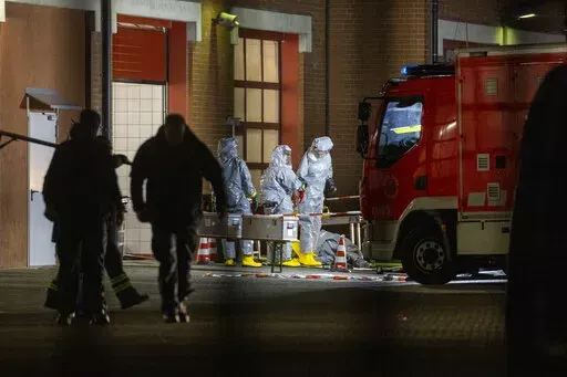 Substances found during the search are examined on the premises of the fire department in Castrop-Rauxel, Sunday, Jan.8, 2023. In Castrop-Rauxel, there was a large-scale operation by the police and fire department on Saturday evening. A special task force (SEK) was also on the scene, a police spokeswoman told the German Press Agency on Saturday evening. (Christoph Reichwein/dpa via AP)