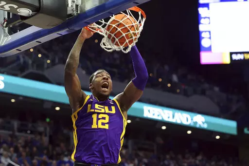 LSU's KJ Williams dunks during the second half of an NCAA college basketball game against Kentucky in Lexington, Ky., Tuesday, Jan. 3, 2023. Kentucky won 74-71. (AP Photo/James Crisp)