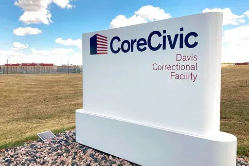 The Davis Correctional Facility, a private prison in Holdenville, Oklahoma, operated by Tennessee-based CoreCivic, is shown on Sept. 20, 2022. The 1,700-bed men’s prison where a correctional officer was fatally stabbed this summer has struggled to hire and retain staff and was operating at about 70% of its contractually obligated staffing level, according to a 2021 audit of the facility. (AP Photo/Sean Murphy)