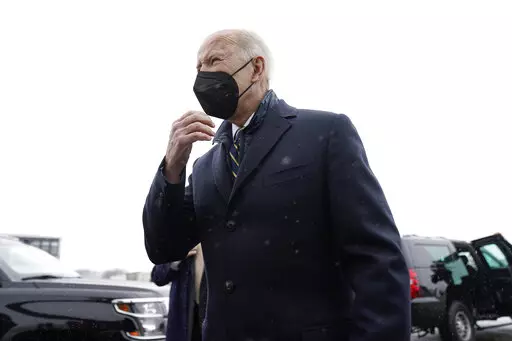 President Joe Biden speaks to members of the media as he arrives at Allegheny County Airport in West Mifflin, Penn., Friday, Jan. 28, 2022. (AP Photo/Andrew Harnik)