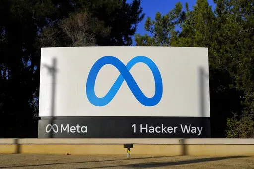 Meta's logo can be seen on a sign at the company's headquarters in Menlo Park, Calif., Nov. 9, 2022. Meta, which is Facebook's parent company, allowed a Moldovan oligarch with ties to the Kremlin to run ads on its platform urging protests against that country's government — even though he and his political party are subject to U.S. sanctions. (AP Photo/Godofredo A. Vásquez, File)