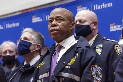 FILE — New York Mayor Eric Adams speaks during the press conference at Harlem Hospital after the shooting of a New York City Police Department officer, in Harlem, Friday, Jan. 21, 2022, in New York. Adams is set to propose Wednesday, April 20,  that the city spend $4.8 million to reach out to those most impacted by the so-called war on drugs.  (AP Photo/Yuki Iwamura File)