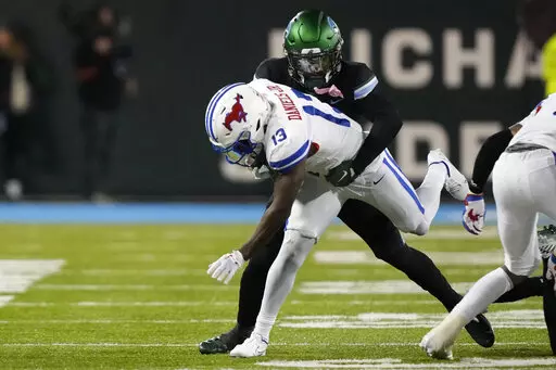 Southern Methodist wide receiver Roderick Daniels Jr. (13) carries during the second half of an NCAA college football game against Tulane in New Orleans, Thursday, Nov. 17, 2022. Tulane won 59-24. (AP Photo/Gerald Herbert)