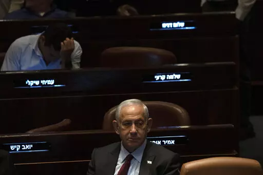 Israeli Prime Minister designate Benjamin Netanyahu, center, pauses during a session after Yariv Levin was selected as Speaker of the Knesset, Israel's parliament, in Jerusalem, Tuesday, Dec. 13, 2022. Over 1,000 senior Israeli air force veterans, including a former Israeli chief of staff, on Monday, Dec. 26, 2022, urged the country’s top legal officials to stand tough against the incoming government, saying the alliance of religious and ultranationalist parties threatens Israel’s future.(AP